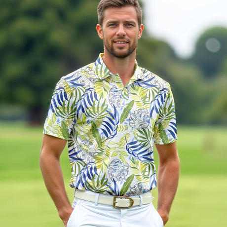 A man standing on a golf course wearing a yellow, green and blue tropical print golf polo shirt.