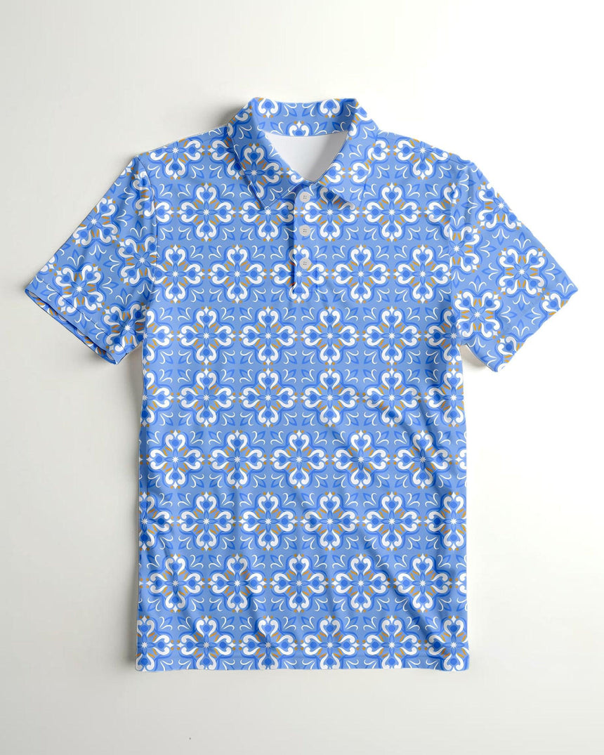 Flat lay of light blue golf polo shirt with white and gold floral pattern