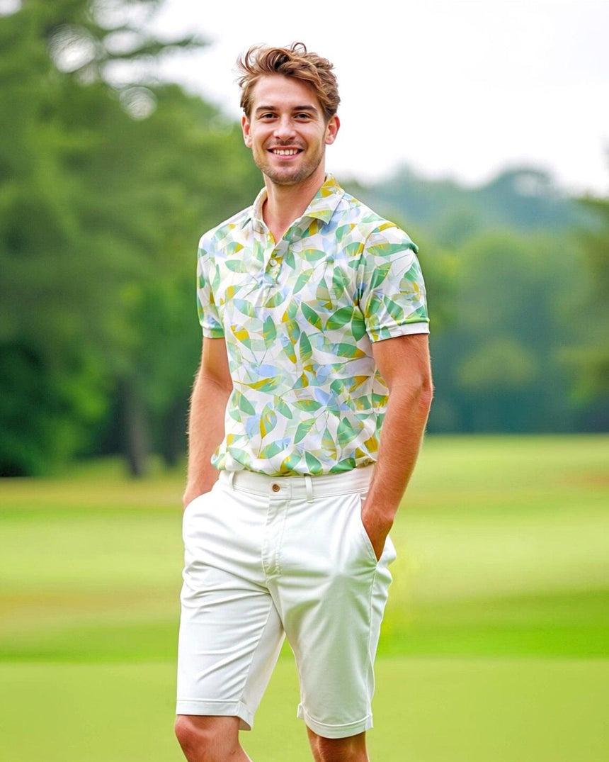 A man on a golf course wearing a colorful leaf print golf polo shirt