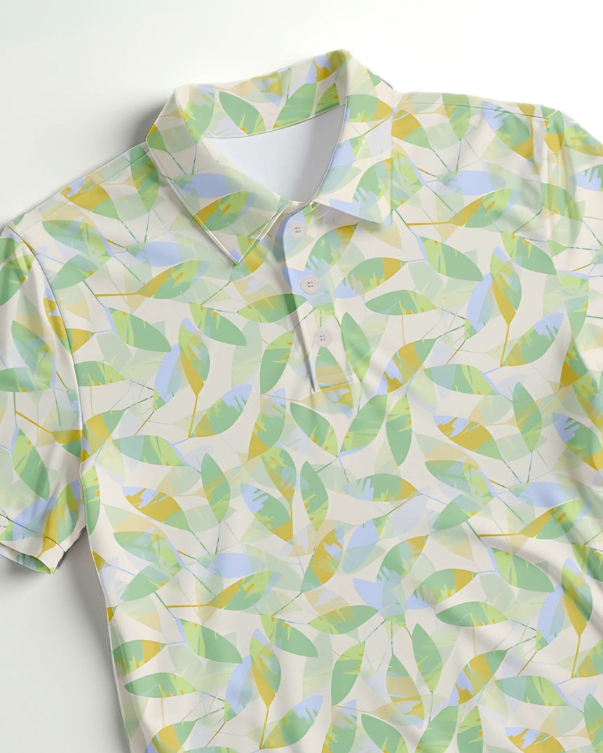 Close up of a green and white leaf patterned polo shirt