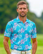 Man wearing a blue and pink floral golf polo shirt on a golf course