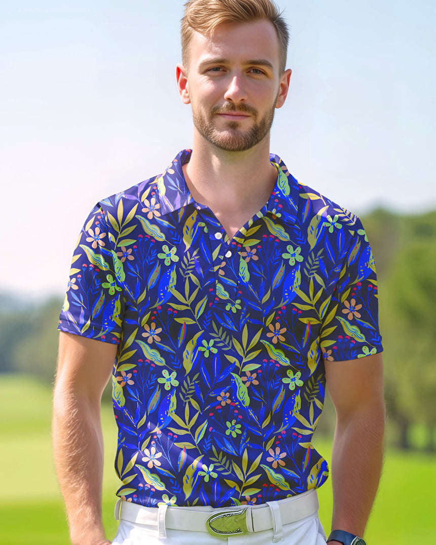 Man standing on a golf course wearing a deep purple blue floral golf polo shirt