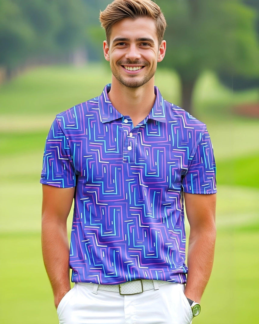 A man on a golf course wearing a purple geometric pattern golf polo