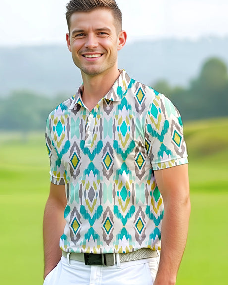 Man standing on a golf course wearing a teal, beige and yellow geometric ikat tribal pattern golf shirt