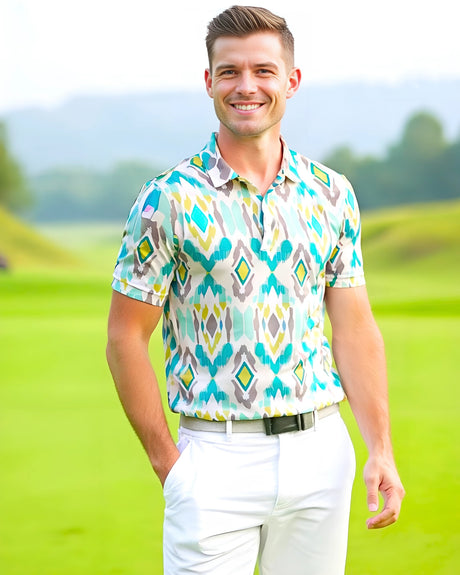 Man standing on a golf course wearing a teal, beige and yellow ikat tribal print golf polo shirt
