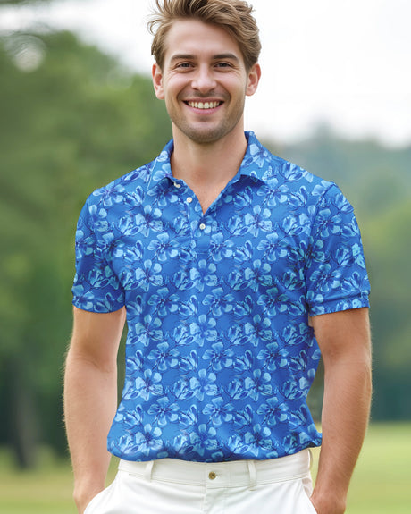 Man wearing a blue floral pattern polo shirt standing on a golf course