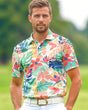 Man wearing a colorful floral print golf polo shirt on a golf course