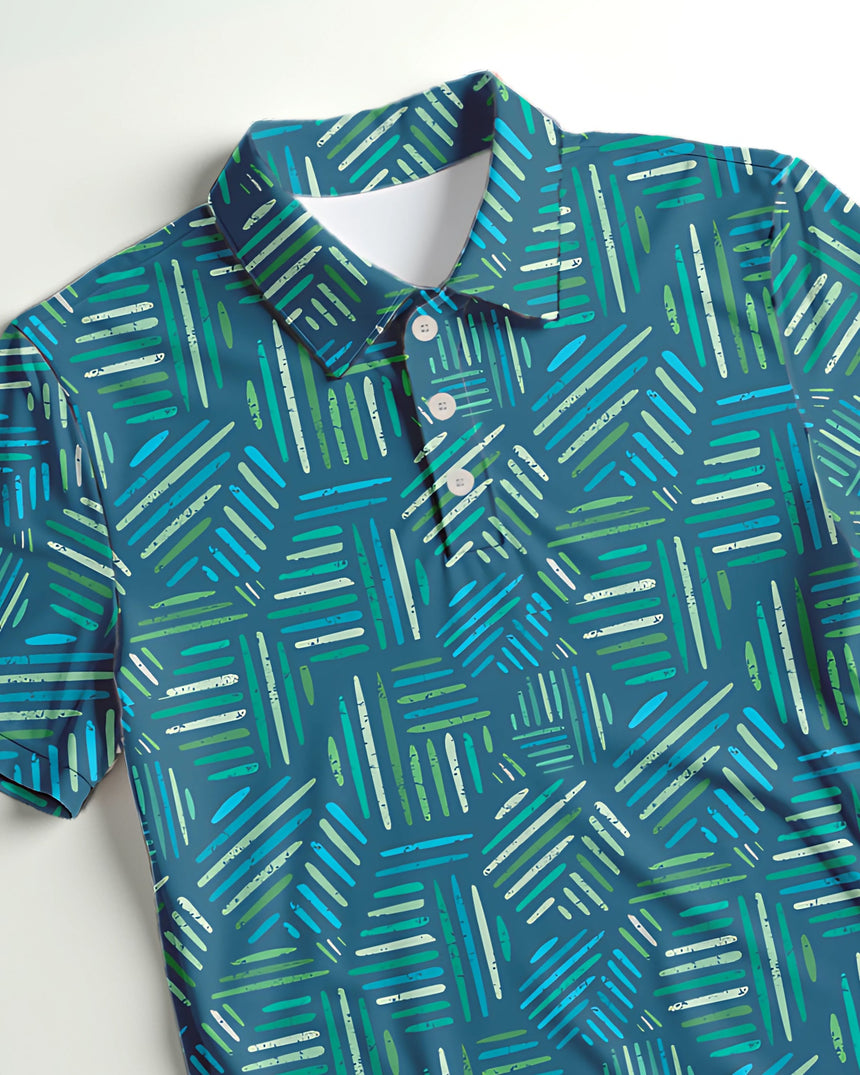 Close-up of a teal, green and blue geometric pattern golf polo