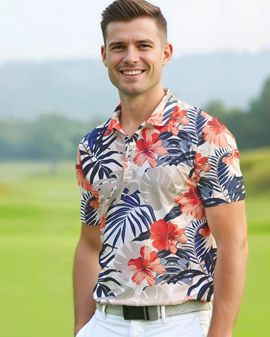 Man on a golf course wearing a tropical print short sleeve men's golf polo shirt.