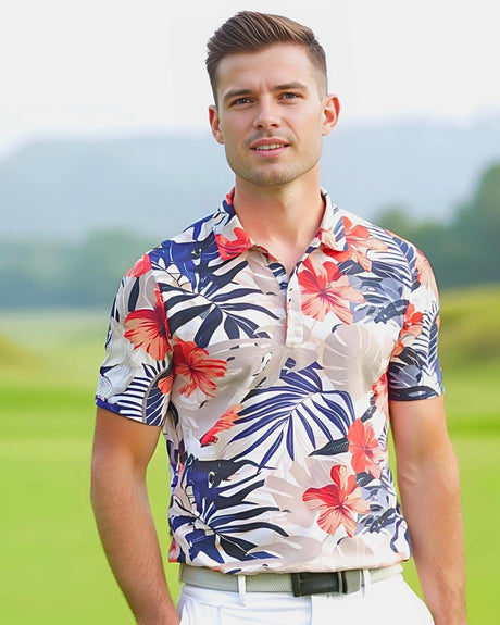Man on a golf course wearing a tropical print short sleeve men's golf polo shirt.