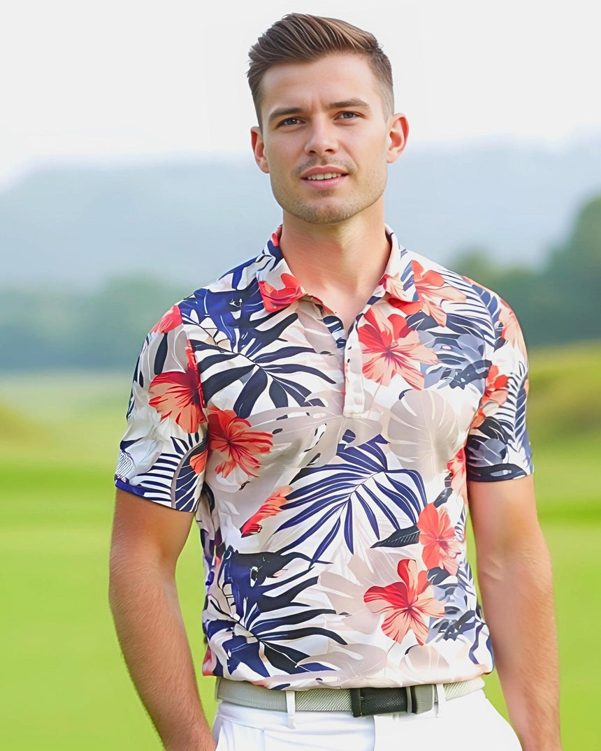 Man on a golf course wearing a tropical print short sleeve men's golf polo shirt.