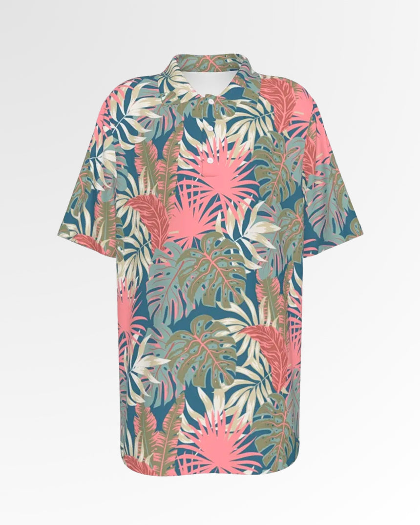 A golf polo shirt with a tropical leaf pattern on a white background.