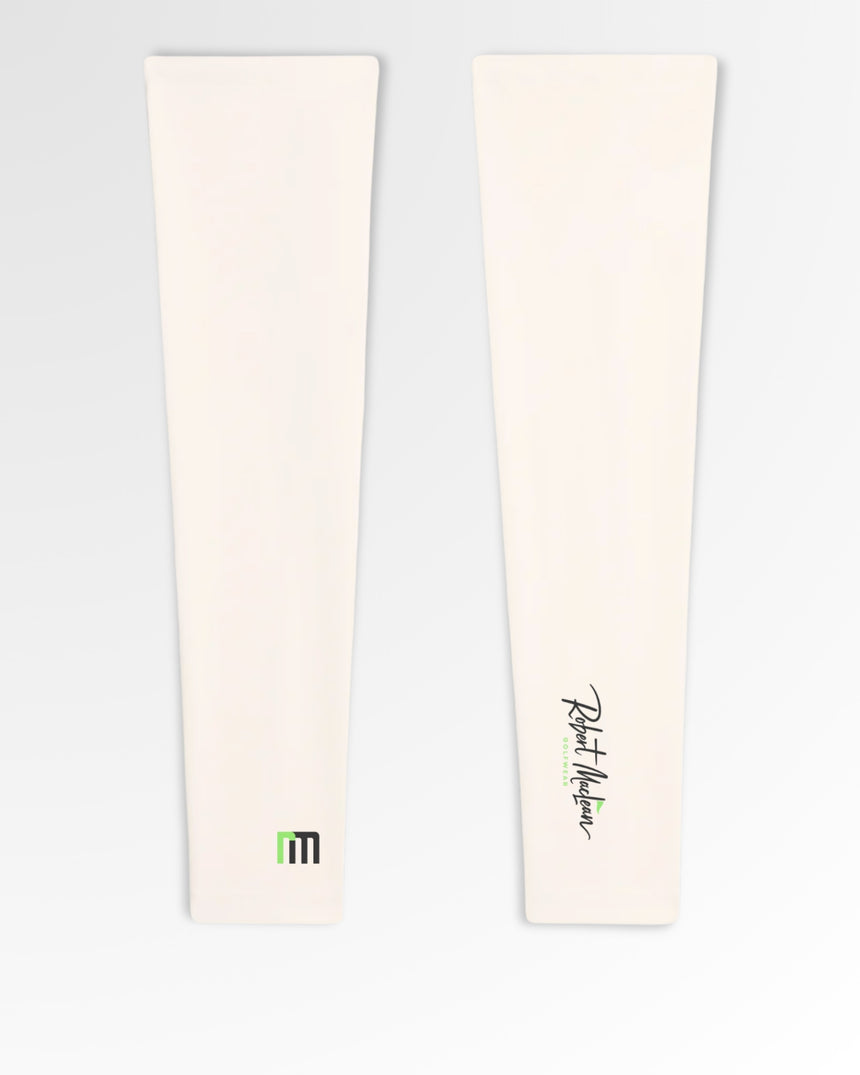 Golf polos in cream color, featuring the brand's logo.