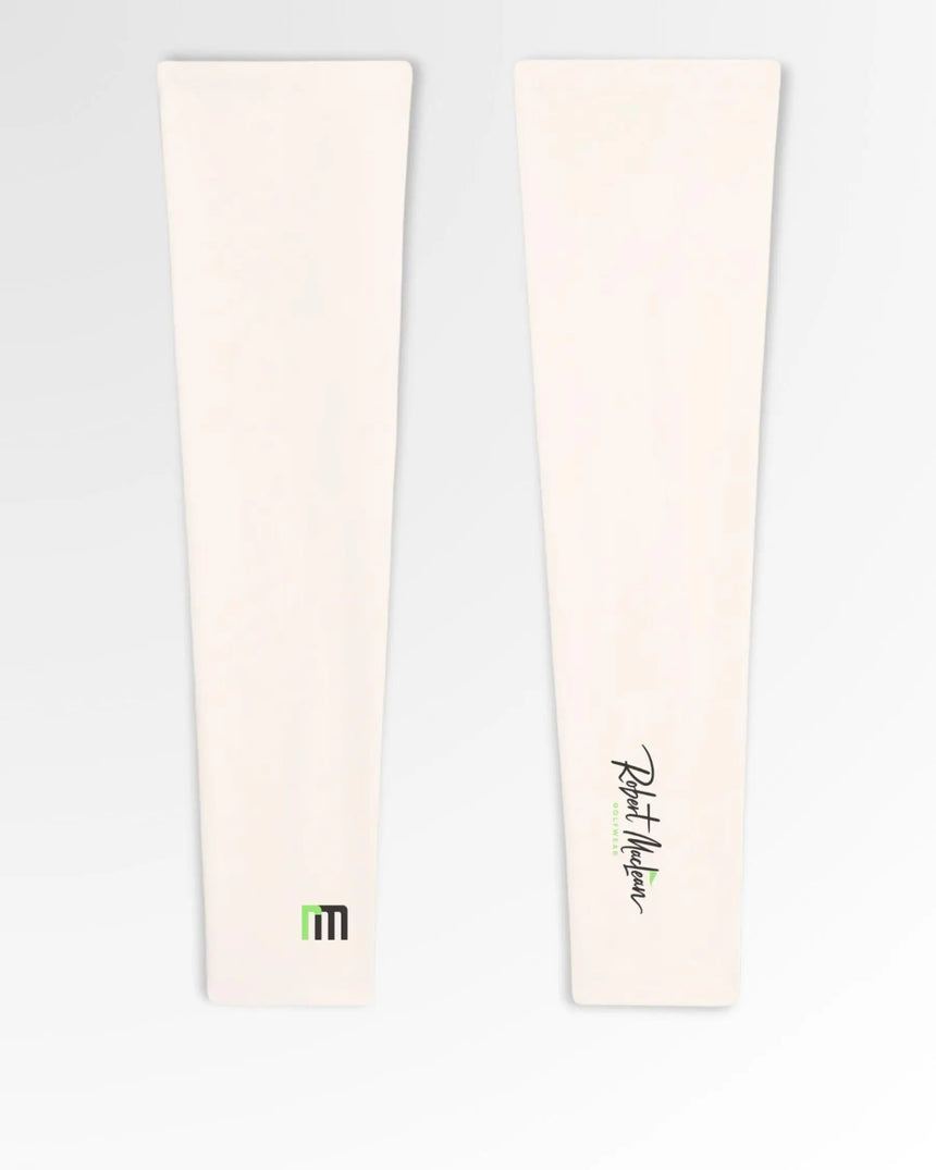 Golf polos in cream color, featuring the brand's logo.