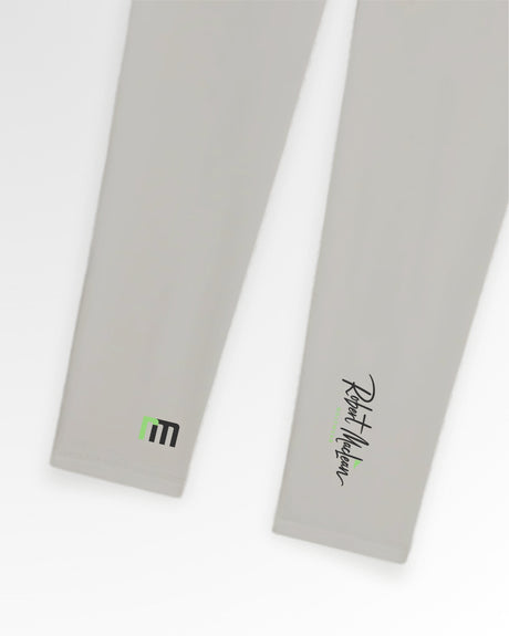 Close-up of Robert Maclean Golf Wear polo shirts in light gray, showcasing the brand's logo on one sleeve and the signature on the other.