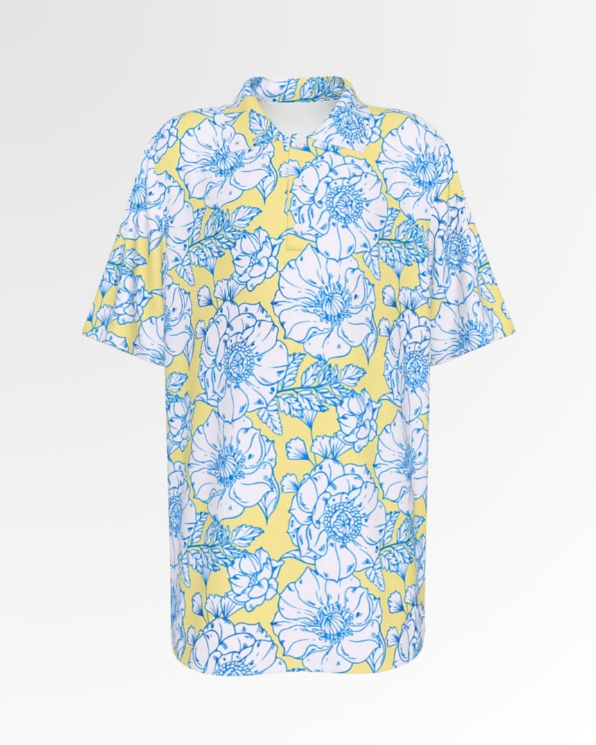 Golf polo shirt with a yellow background and a white and blue floral pattern.