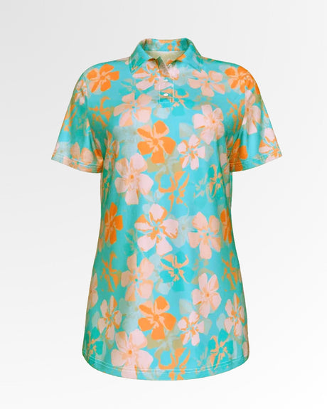 A women's golf polo shirt with a floral pattern in orange and light pink on a turquoise background.