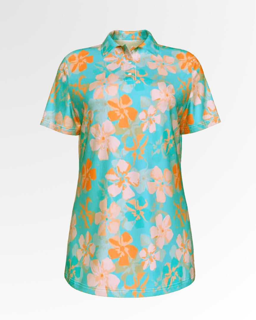 A women's golf polo shirt with a floral pattern in orange and light pink on a turquoise background.