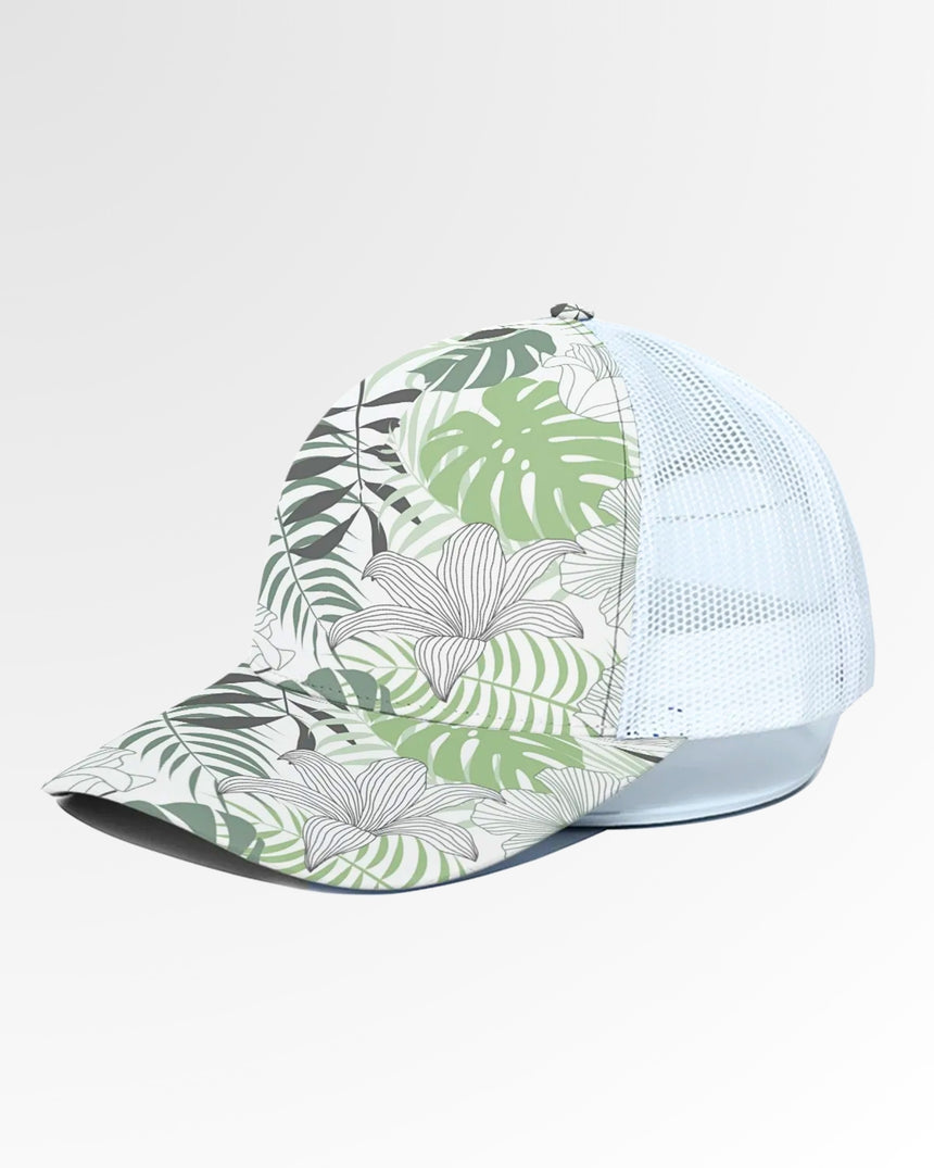 Golf wear brand image of a baseball cap with a white mesh back and a tropical leaf and flower pattern on the front and bill.