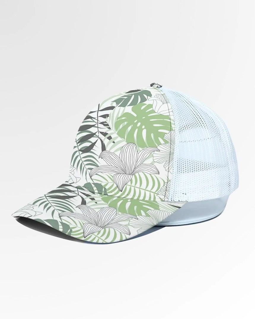 Golf wear brand image of a baseball cap with a white mesh back and a tropical leaf and flower pattern on the front and bill.