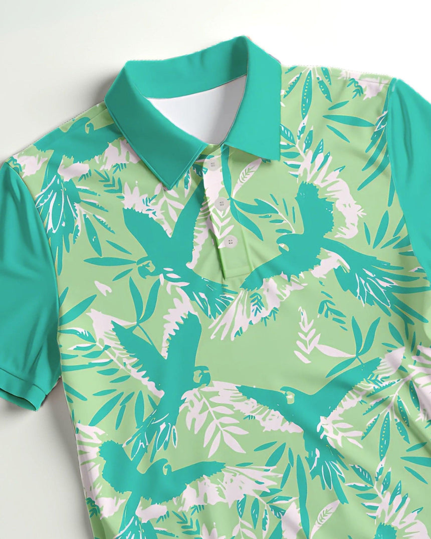 Green golf polo with tropical bird and leaf pattern on a white background