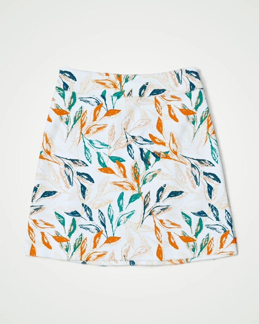 women's fitted golf skort with pockets in Leaf It On the Green print - front view