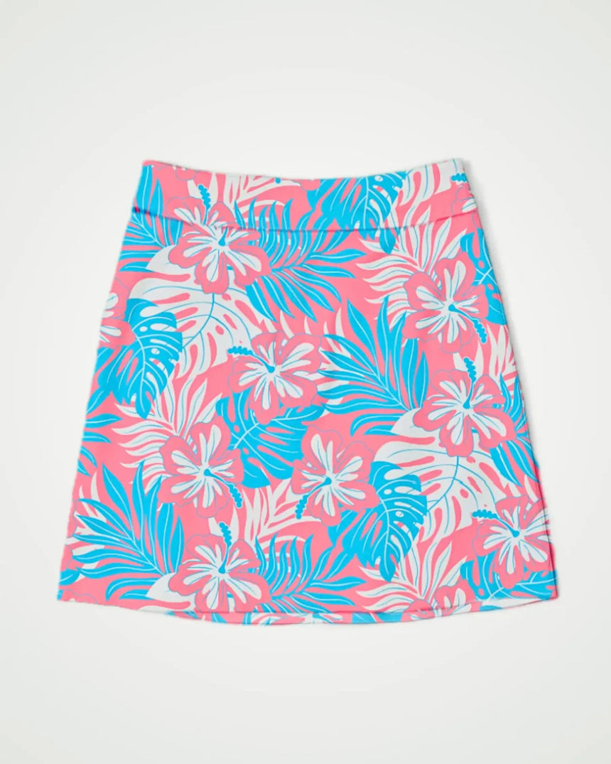 women's fitted golf skort with pockets in Pink Palms print - front view