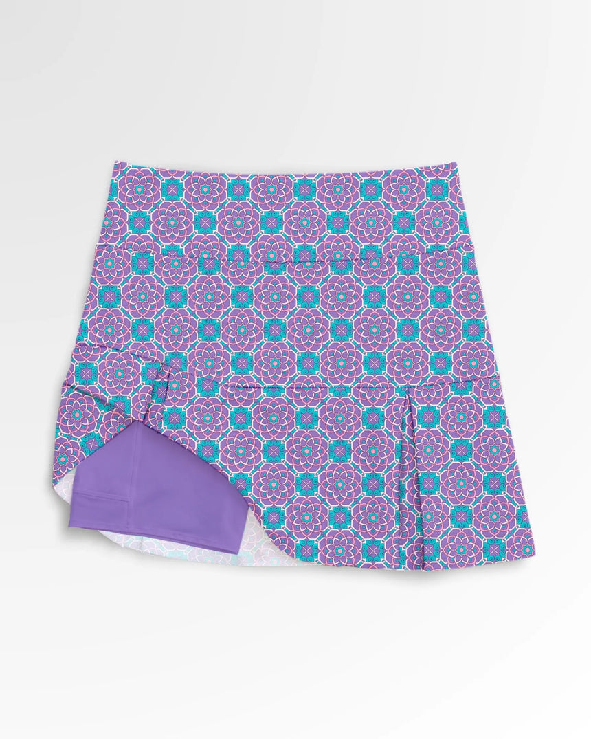 women's pleated golf skort with pockets in Kaleido Blossom print - front view