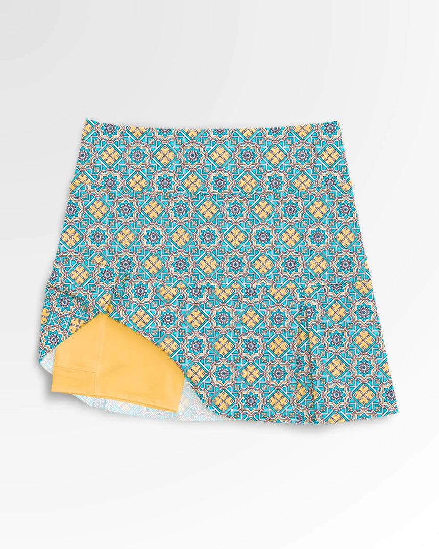women's pleated golf skort with pockets in Sunset Swing print - front view