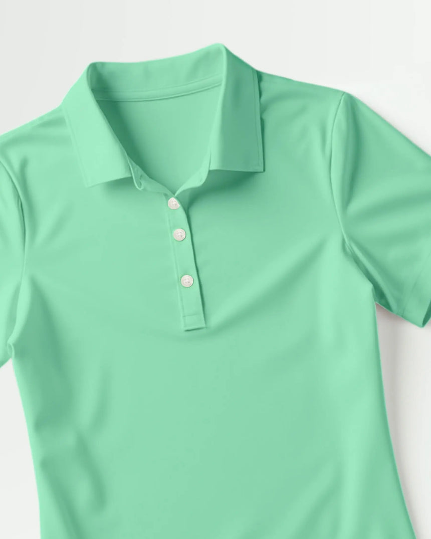women's short sleeve golf polo in Checkered Greens print - fabric closeup front view