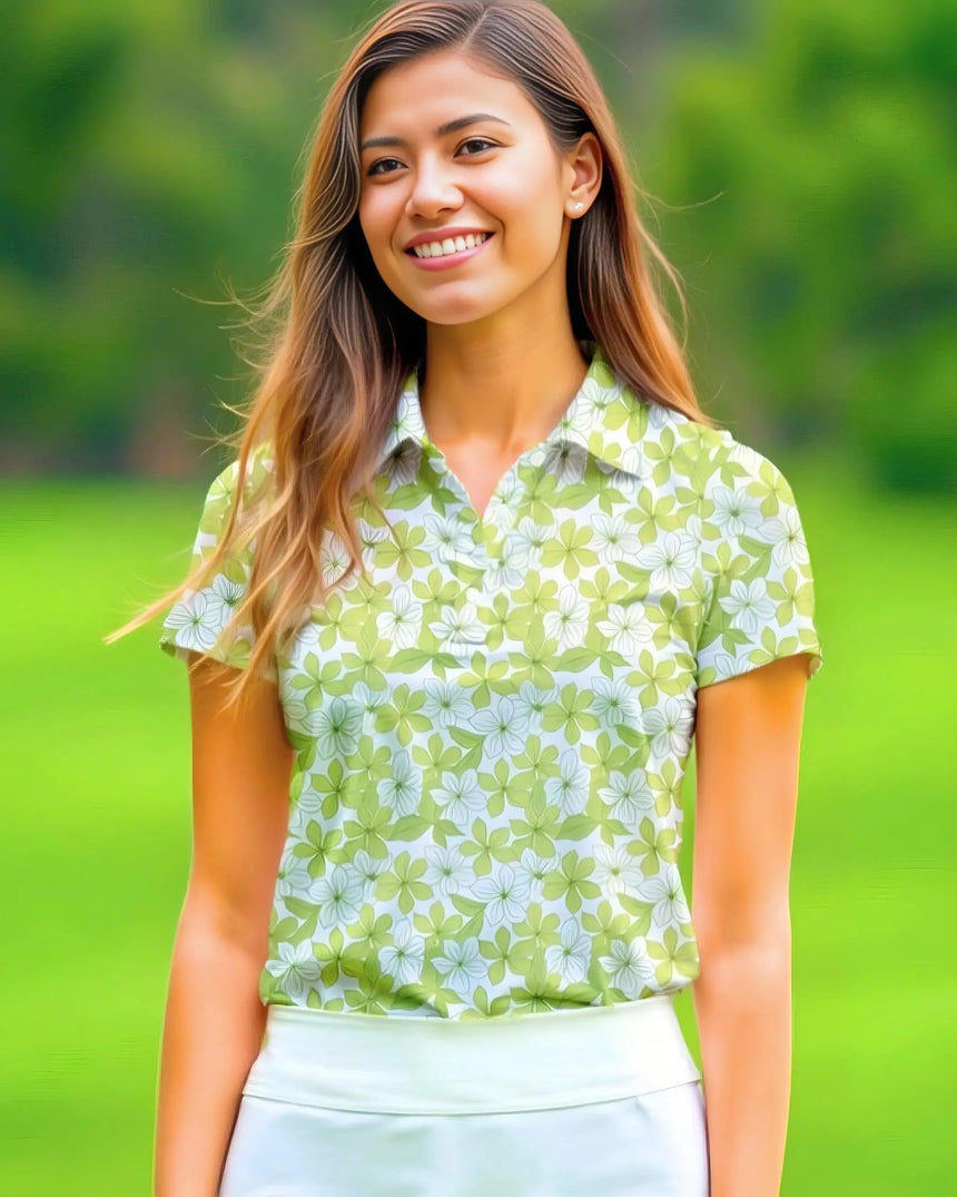 women's short sleeve golf polo in Spring Greens print - model wearing on course