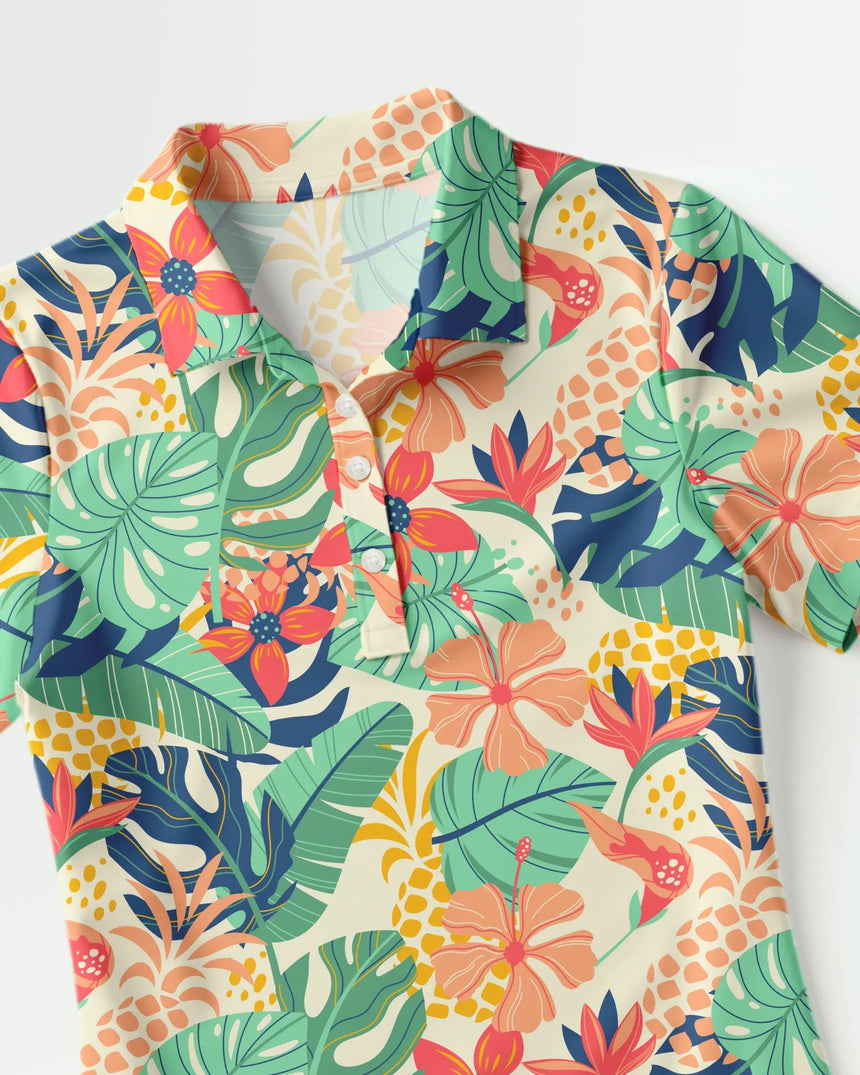 women's short sleeve golf polo in Tee Time Tropic print - fabric closeup front view