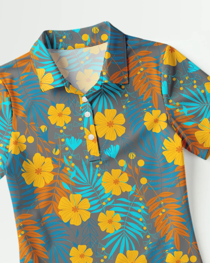 women's short sleeve golf polo in Tropical Mirage print - fabric closeup front view