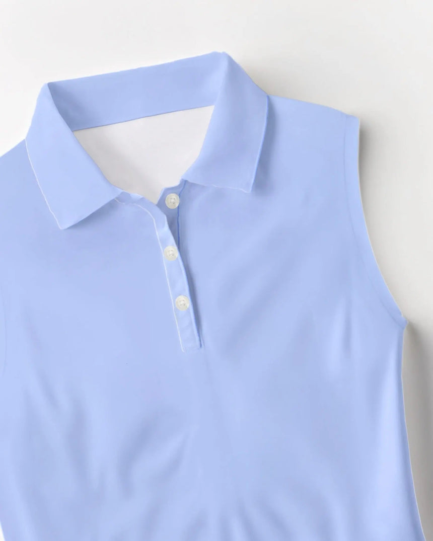 women's sleeveless golf polo in Blue Palms print - fabric closeup front view