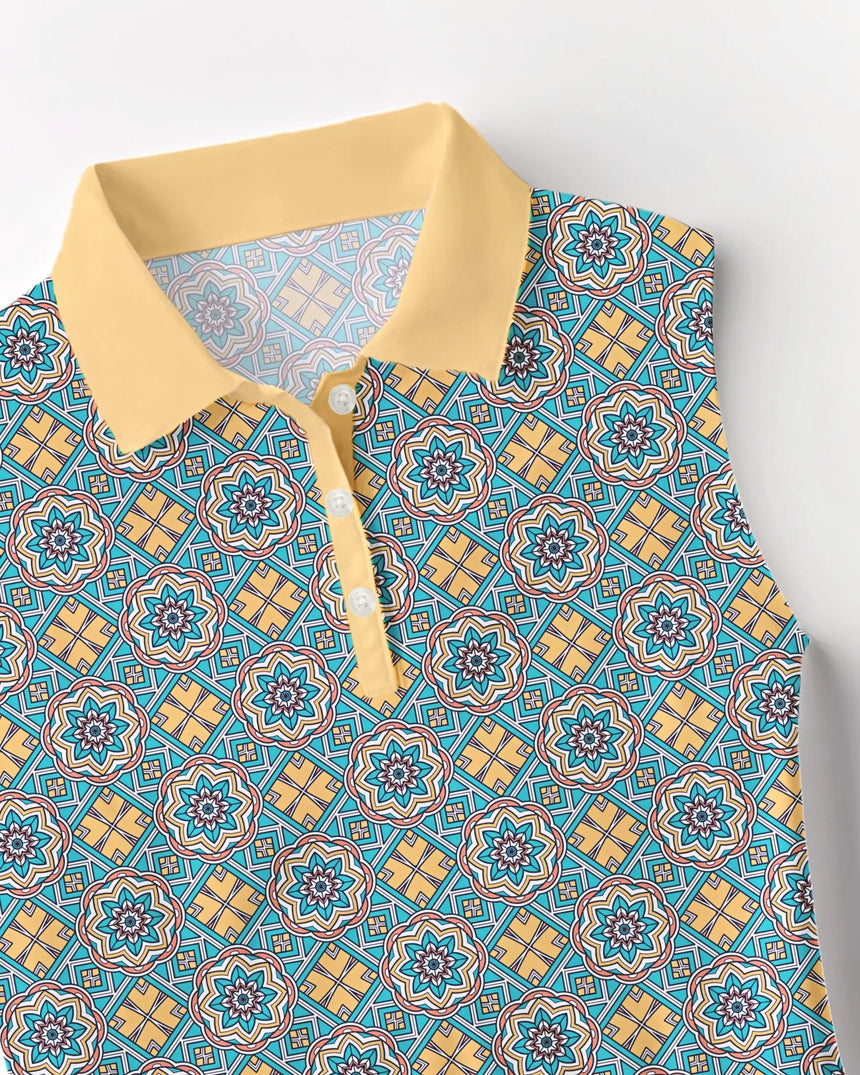 women's sleeveless golf polo in Sunset Swing print - fabric closeup front view