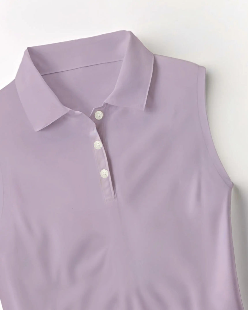 women's sleeveless golf polo in Whispering Wedges print - fabric closeup front view