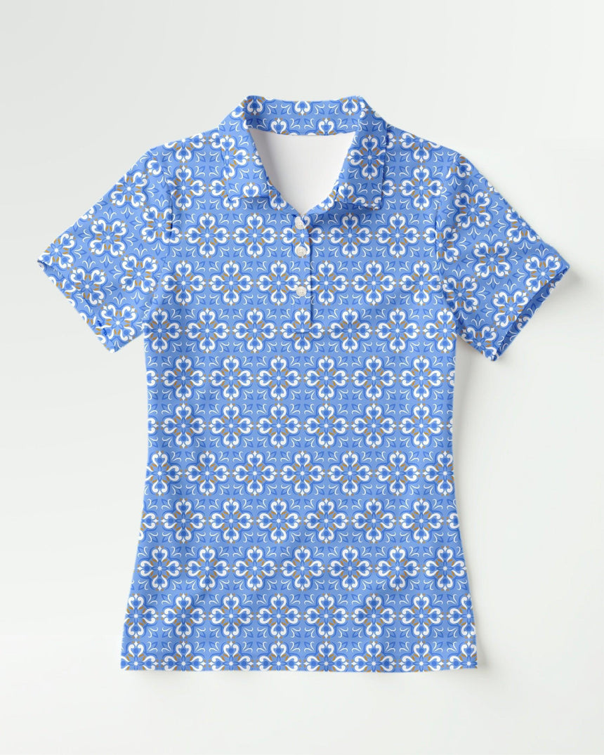 Blue floral patterned polo shirt on a white background