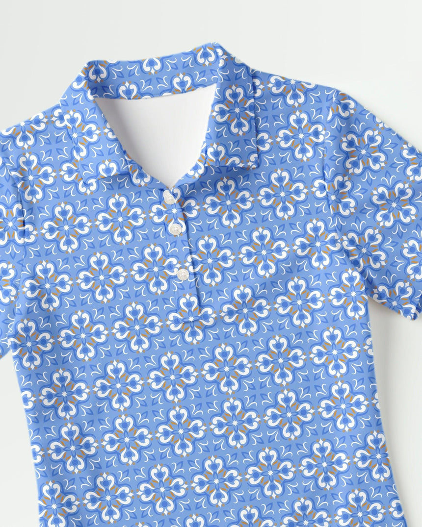 Blue floral patterned golf polo shirt on a white background