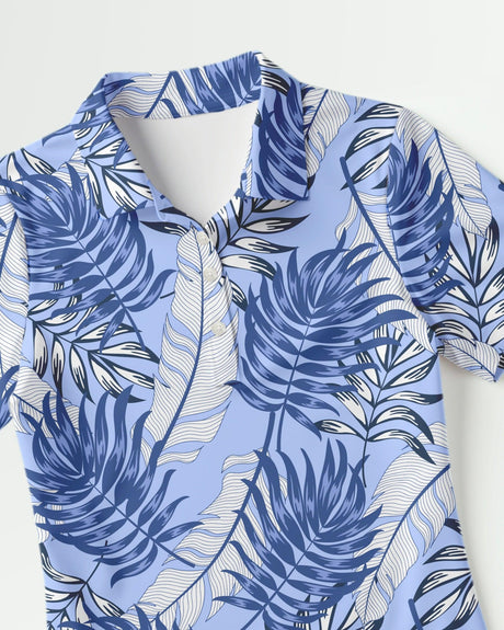Blue and white leaf patterned women's golf shirt on a white background