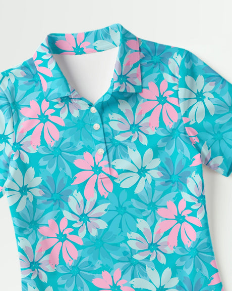 Turquoise golf polo shirt with pink and white floral pattern on a white background