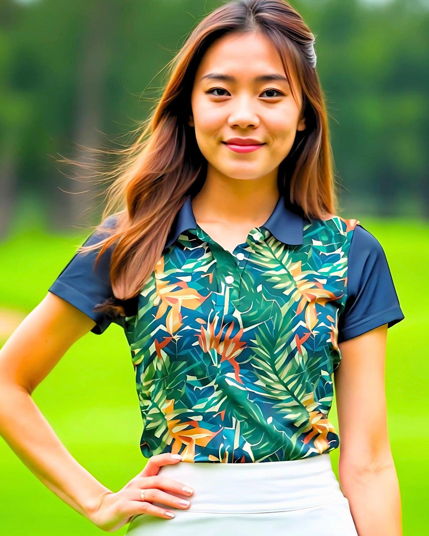 Woman wearing a colorful tropical leaf patterned shirt with a blurred green background