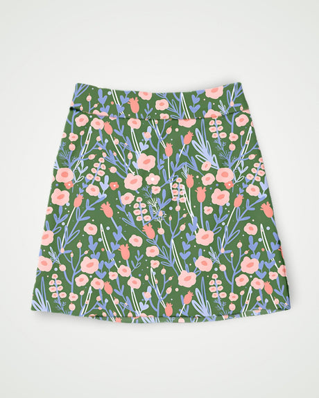 Green and pink ditsy floral pattern golf skort on a white background