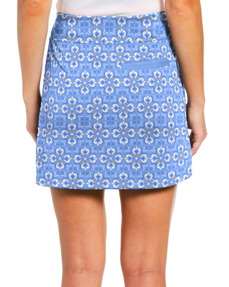 Blue patterned skort with pockets worn by a person on a white background