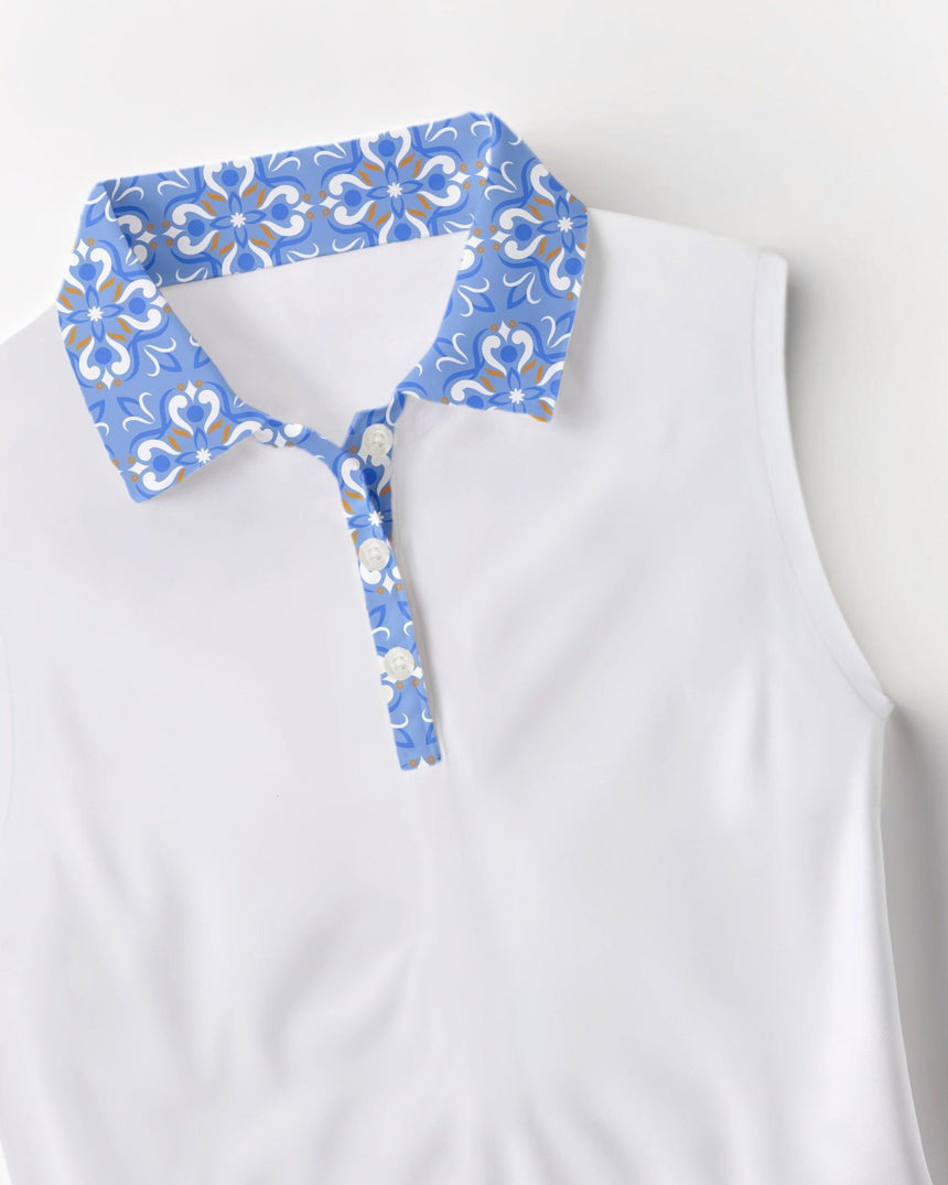 White sleeveless polo shirt with a blue floral collar on a white background