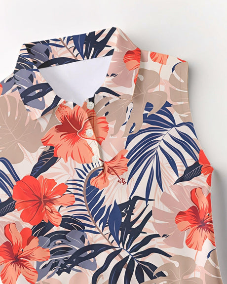Tropical leaf and flower patterned polo shirt on a white background