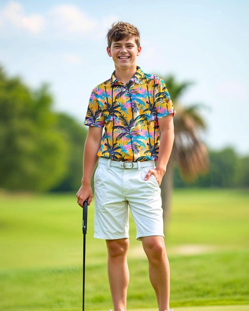youth short sleeve golf polo in The Palms print - model wearing on course
