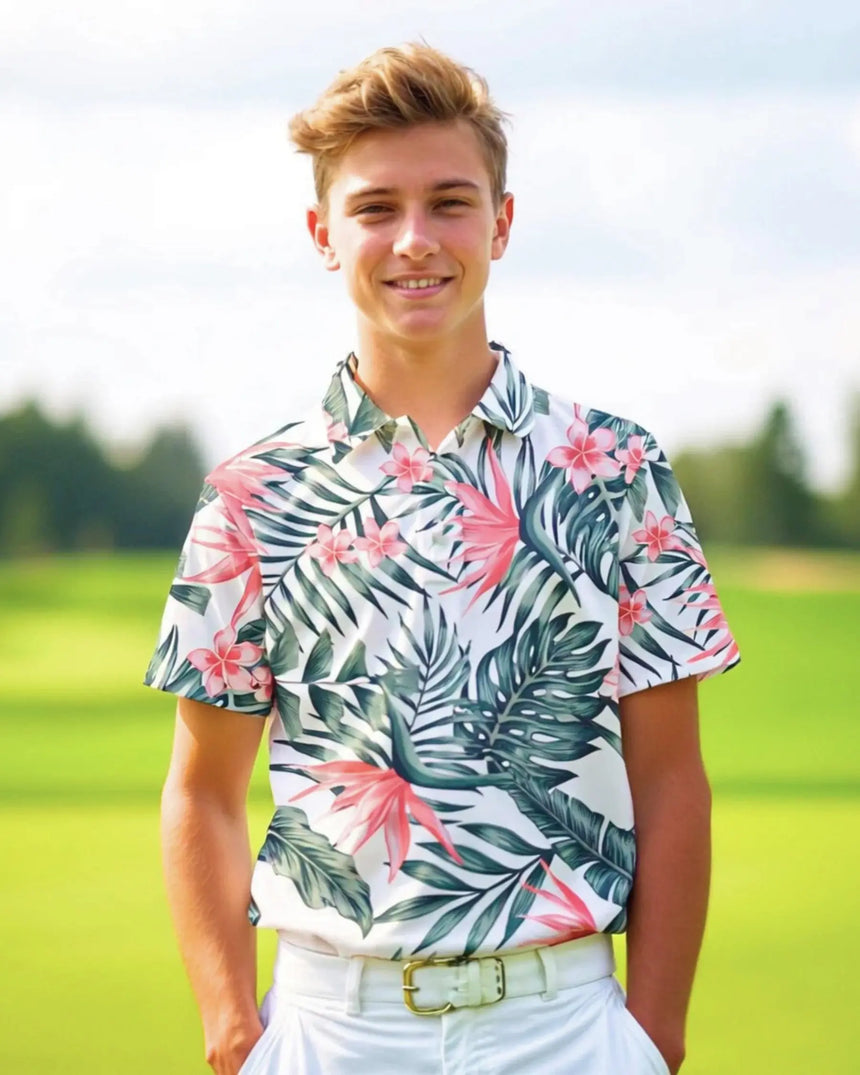 youth short sleeve golf polo in Tropical Fare print - model wearing on course