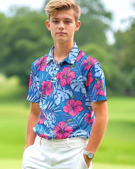 Young boy on a golf course wearing a colorful floral polo shirt