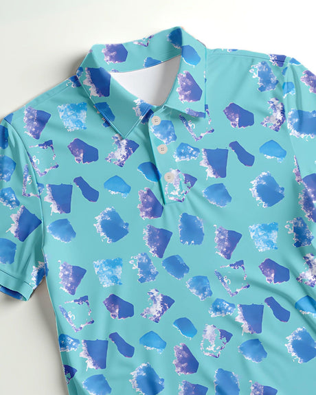 Blue and purple patterned polo shirt on a light gray background