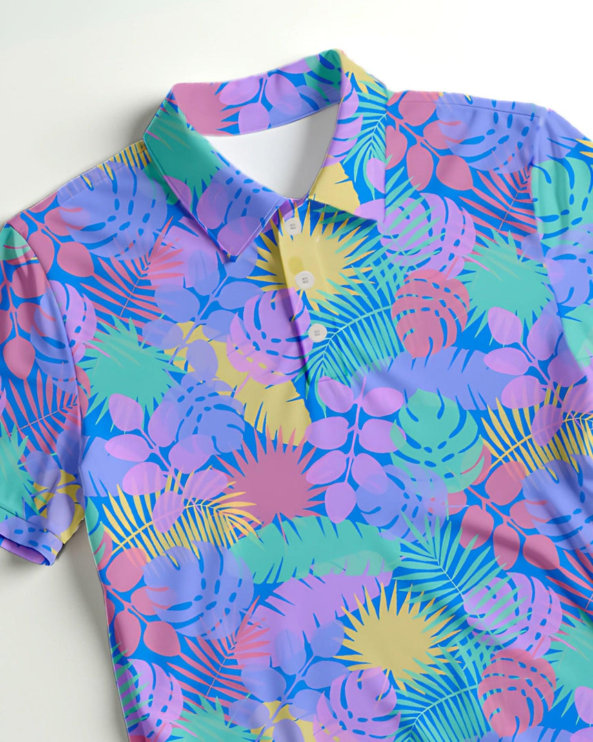 Colorful tropical patterned golf polo on a white background